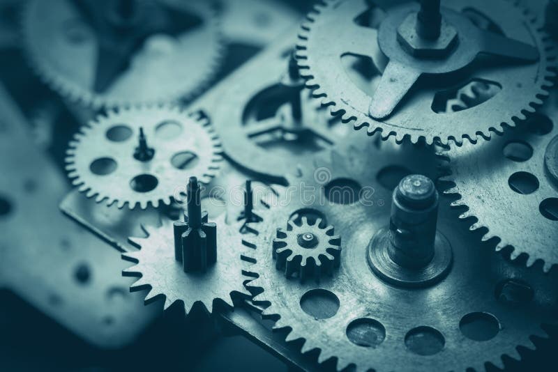 Gears and cogs macro, blue toned stock photography