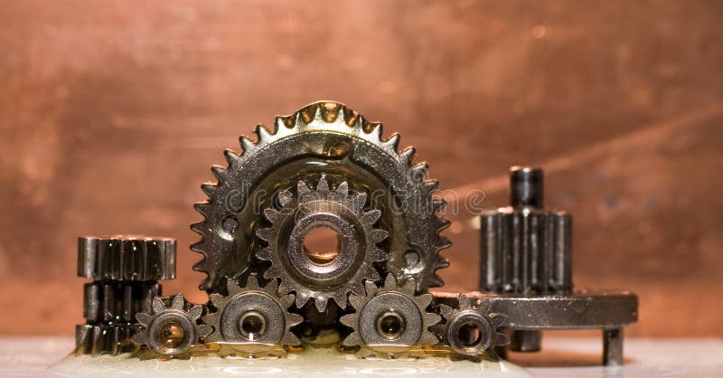 Planetrary gears standing up covered in oil. Power tech stock images, royalty-free photos and pictures
