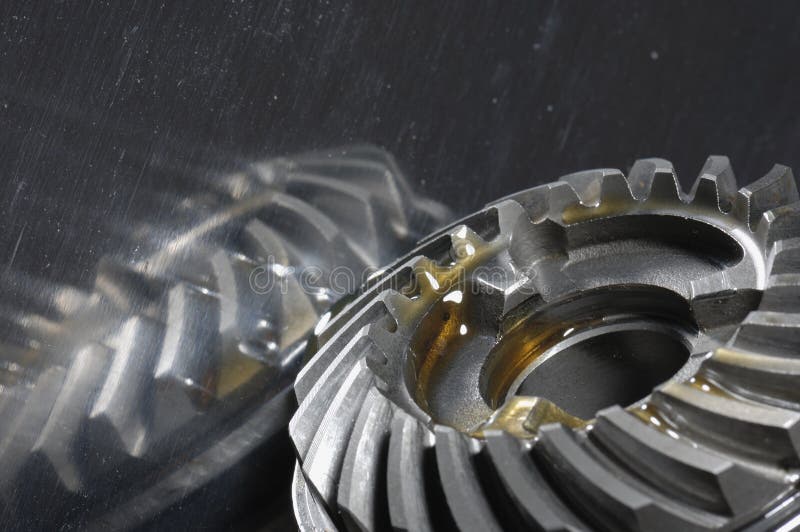 Gears with oil reflection royalty free stock photography