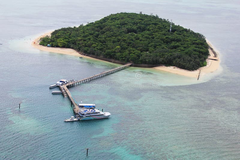 GREEN ISLAND, AUSTRALIA- MARCH 22: Areal view of Green Island, Great Barrier Reef, Australia on March 22, 2011. Green Island is located within the Great Barrier Reef Marine Park, World Heritage Area. GREEN ISLAND, AUSTRALIA- MARCH 22: Areal view of Green Island, Great Barrier Reef, Australia on March 22, 2011. Green Island is located within the Great Barrier Reef Marine Park, World Heritage Area