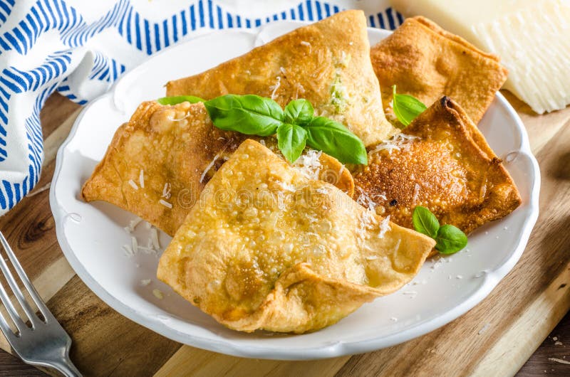 Fried ravioli stuffed wtih garlic,herbs and parmesan, simple and delicious food. Fried ravioli stuffed wtih garlic,herbs and parmesan, simple and delicious food