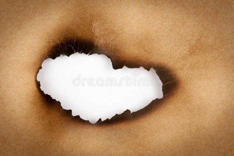 Gebranntes Loch des Papiers stockfotografie Gebranntes Loch des Papiers stockfotografie