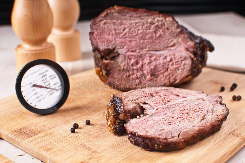 Roasted meat slice and thermometer for cooking. Roasted meat slice and thermometer for cooking