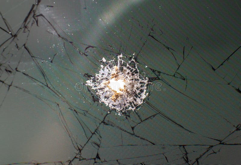 Gebroken glas van kogel Fototextuur sluiten royalty-vrije stock afbeeldingen