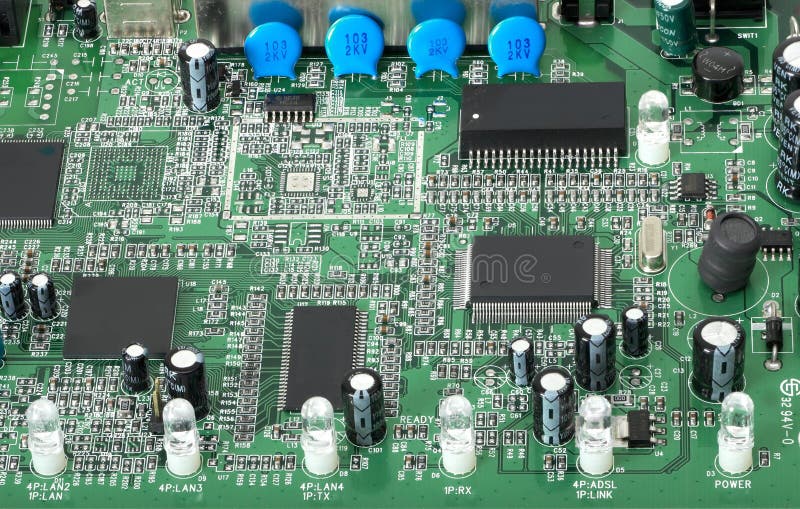 Close up view of a modern printed circuit board showing various electronic components and connectors. Close up view of a modern printed circuit board showing various electronic components and connectors