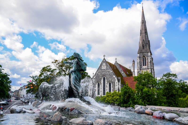 The Gefion Fountain Gefionspringvandet is a large fountain on the harbour front in Copenhagen, Denmark along with St. Alban& x27;s Church in background. The Gefion Fountain Gefionspringvandet is a large fountain on the harbour front in Copenhagen, Denmark along with St. Alban& x27;s Church in background