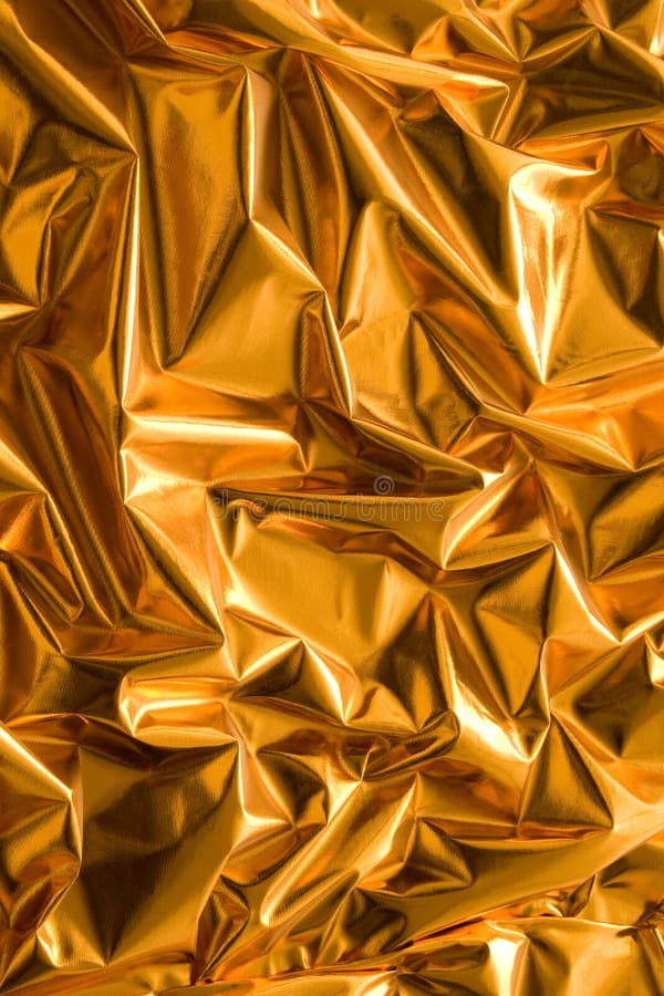 Gekrümmtes Goldpapier stockbilder
