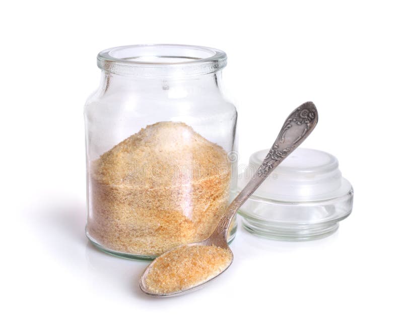 Gelatin or gelatine in the glass jar. On white background.