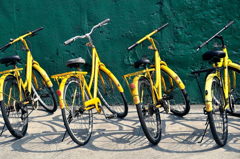 Image of yellow bicycles on a sunny day. Image of yellow bicycles on a sunny day.