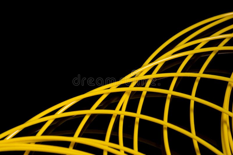 Yellow ABS plastic for 3D printer,black background. Yellow ABS plastic for 3D printer,black background