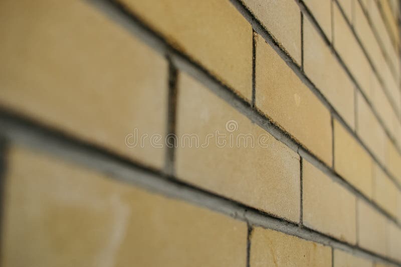 Gelber Hintergrund der Backsteinmauernahaufnahme für errichtenden Entwurf Bau von Häusern lizenzfreies stockbild Gelber Hintergrund der Backsteinmauernahaufnahme für errichtenden Entwurf Bau von Häusern lizenzfreies stockbild