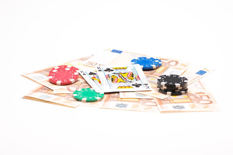 Geld met pookspaanders en kaarten stock afbeeldingen Geld met pookspaanders en kaarten stock afbeeldingen