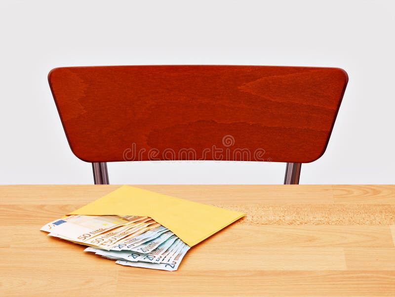 Envelope of Euro notes lies unclaimed on the table. Envelope of Euro notes lies unclaimed on the table.