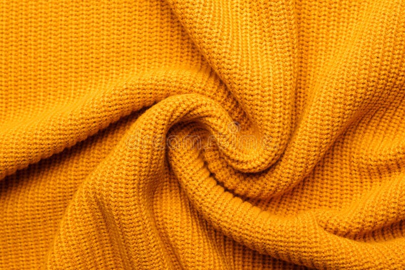 Gele textuur breiwol sjaal. gele textielondergrond brei