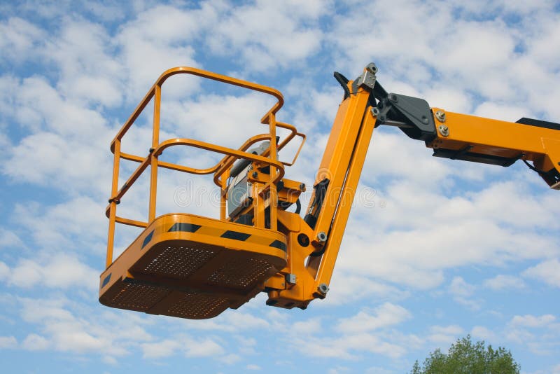 Gele wieg van de hydraulische lift stock afbeeldingen Gele wieg van de hydraulische lift stock afbeeldingen