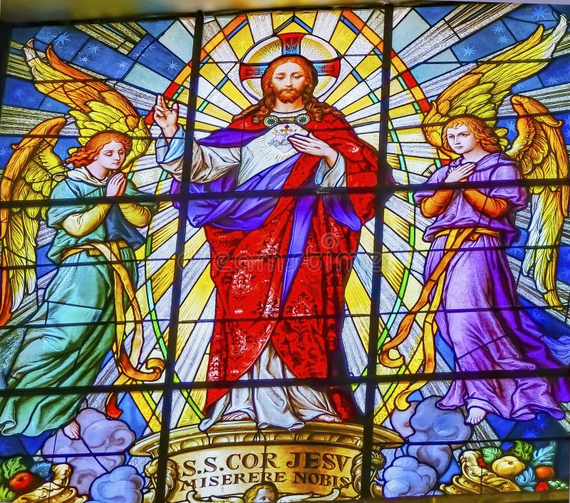 Colorful Jesus Archangels Stained Glass Basilica Cathedral Puebla Mexico. Church built in 15 to 1600s. Words say sacred heart of Jesus have mercy. Colorful Jesus Archangels Stained Glass Basilica Cathedral Puebla Mexico. Church built in 15 to 1600s. Words say sacred heart of Jesus have mercy