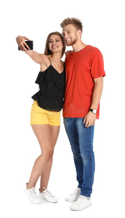 Gelukkig jong paar die selfie op wit nemen stock foto's Gelukkig jong paar die selfie op wit nemen stock foto's