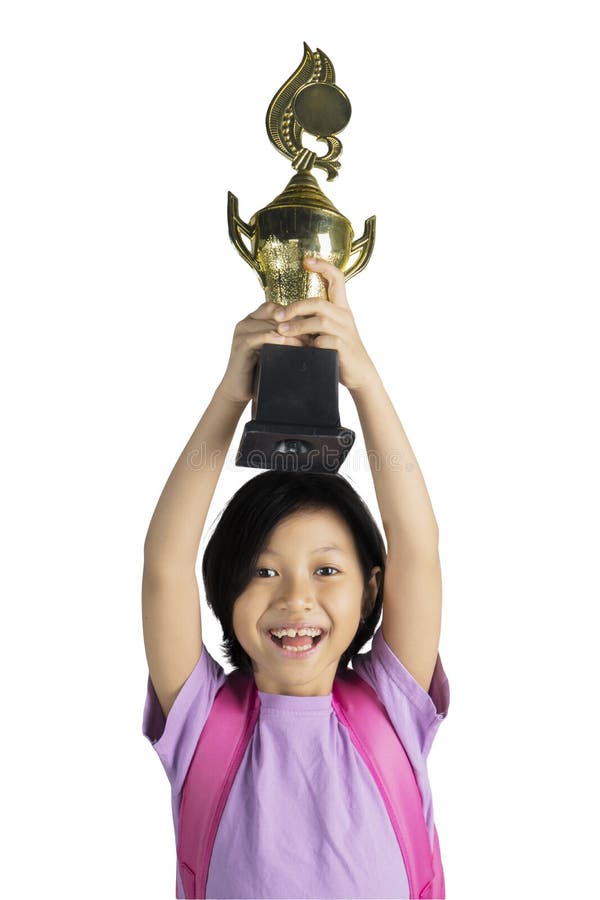 Gelukkig meisje die haar winnende trofee opheffen stock afbeelding Gelukkig meisje die haar winnende trofee opheffen stock afbeelding
