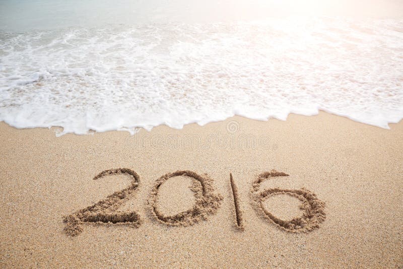 New Year 2016 is coming concept - inscription 2016 on a beach sand. New Year 2016 is coming concept - inscription 2016 on a beach sand