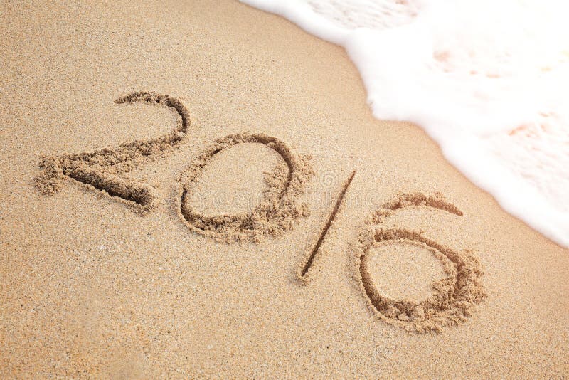 New Year 2016 is coming concept - inscription 2016 on a beach sand. New Year 2016 is coming concept - inscription 2016 on a beach sand