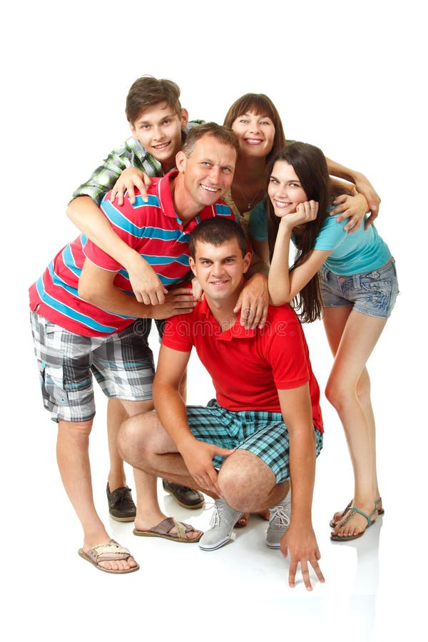 Gelukkige grote Kaukasische familie die pret hebben en over witte bac glimlachen stock fotografie Gelukkige grote Kaukasische familie die pret hebben en over witte bac glimlachen stock fotografie