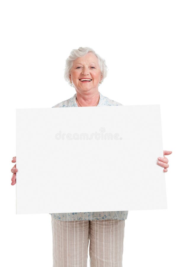 Gelukkige hogere dame met teken stock foto Gelukkige hogere dame met teken stock foto