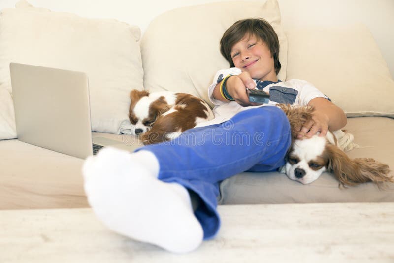 Smiling little boy watching tv. Smiling little boy watching tv