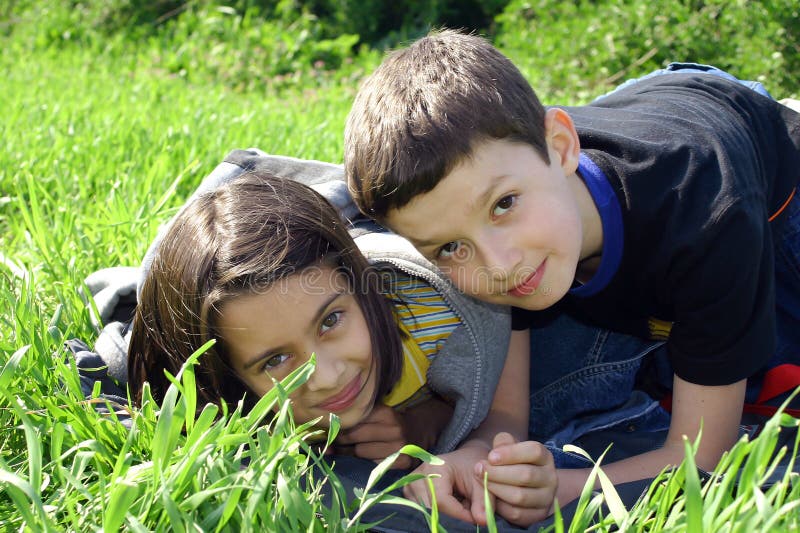 Two happy children in grass. Two happy children in grass