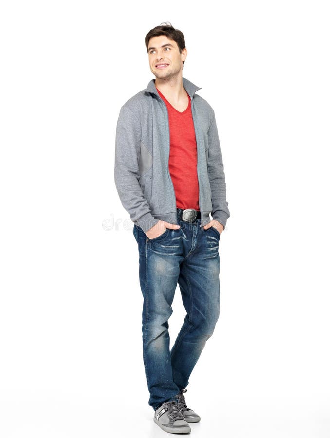 Gelukkige knappe mens in grijze jasje en jeans stock fotografie Gelukkige knappe mens in grijze jasje en jeans stock fotografie