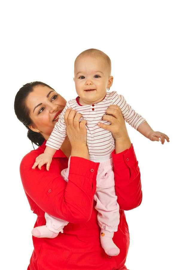 Gelukkige moeder en haar glimlachende baby royalty-vrije stock fotografie Gelukkige moeder en haar glimlachende baby royalty-vrije stock fotografie