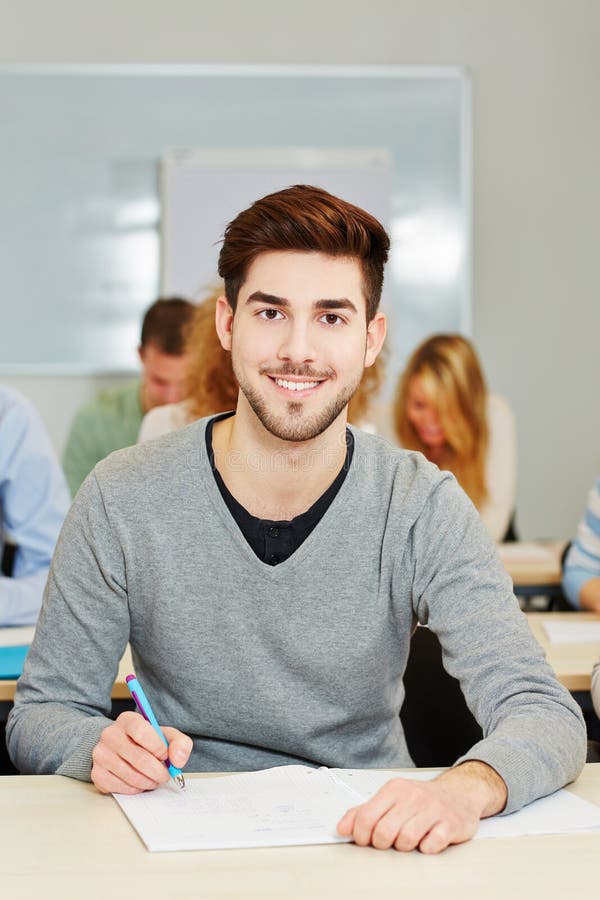 Happy student studying in an university class. Happy student studying in an university class