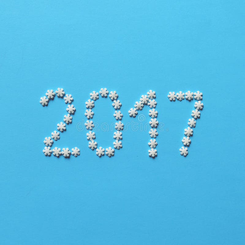 2017 made of sugar snowflakes - Trendy flat lay design - Christamas and New Year concepts. 2017 made of sugar snowflakes - Trendy flat lay design - Christamas and New Year concepts