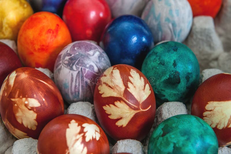 Painted colorful Easter eggs are in the cells in the box. Background. The horizontal frame. Painted colorful Easter eggs are in the cells in the box. Background. The horizontal frame.