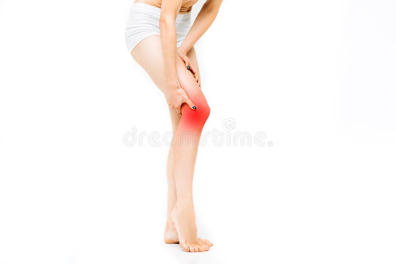 Gemeinsamer Schmerz, weibliche Person mit dem Beinausdehnen stockbild Gemeinsamer Schmerz, weibliche Person mit dem Beinausdehnen stockbild