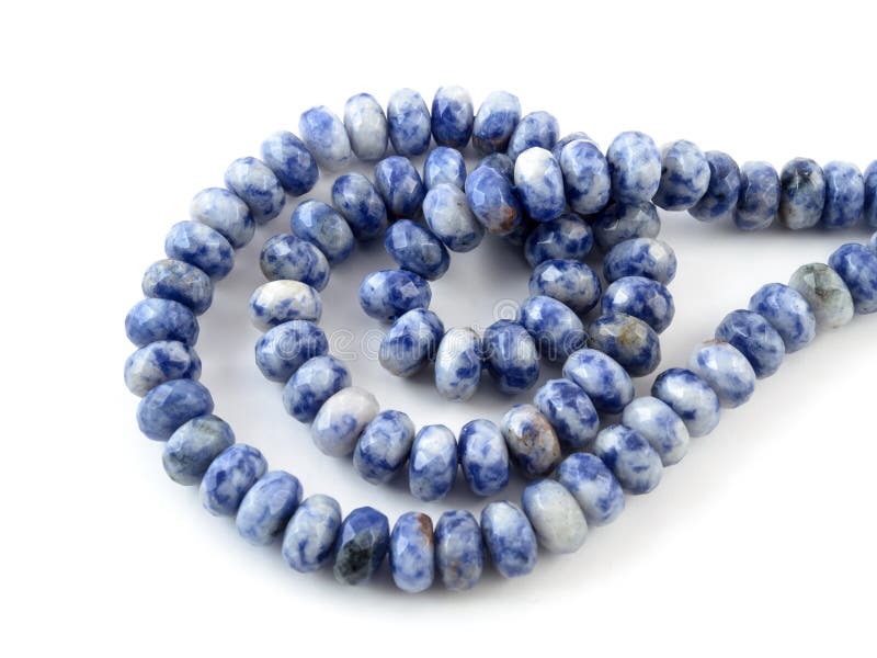 Gemstone natural lapis lazuli on white background, beads.