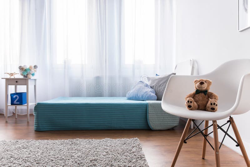 Blue single kid's bed in modern new kid's bedroom. Blue single kid's bed in modern new kid's bedroom