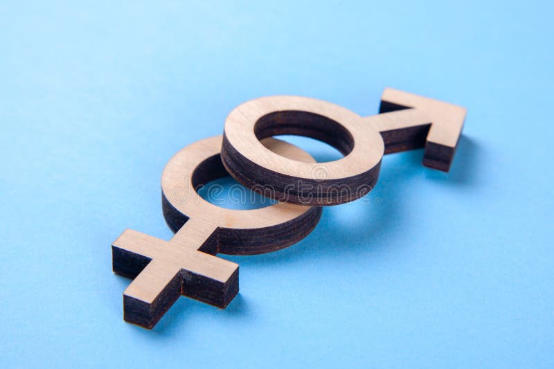 Gender symbols of man and woman of tree on blue background