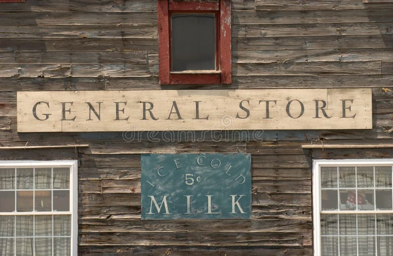 General Store sign on a wooden building alongside with ice-cold milk sign under the sunlight. A General Store sign on a wooden building alongside with ice-cold royalty free stock photos General Store sign on a wooden building alongside with ice-cold milk sign under the sunlight. A General Store sign on a wooden building alongside with ice-cold royalty free stock photos