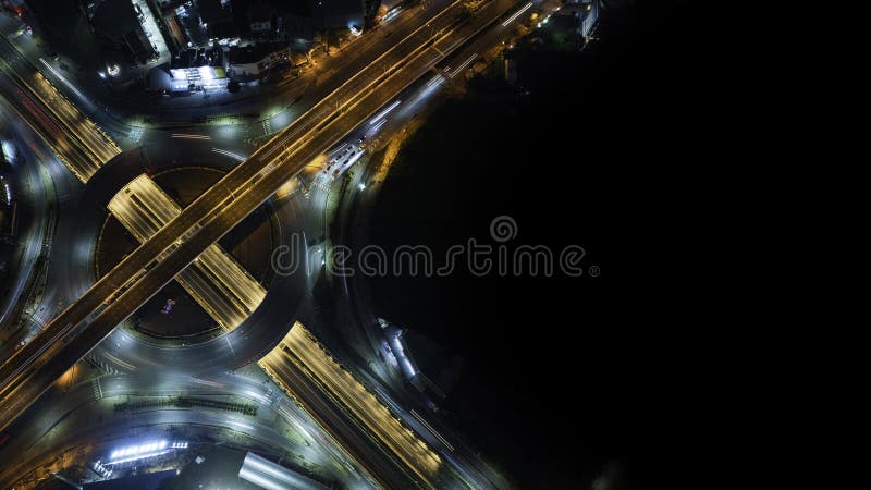 Expressway top view, Road traffic an important infrastructure, car traffic transportation above intersection road in city night