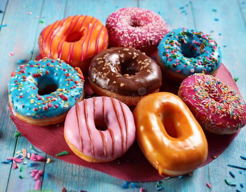 Colorful donuts. Assortiment of donuts with various colors and toppings. vector illustration