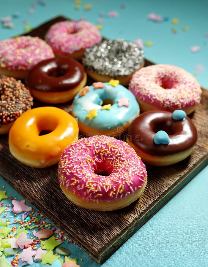 Colorful donuts. Assortiment of donuts with various colors and toppings. vector illustration