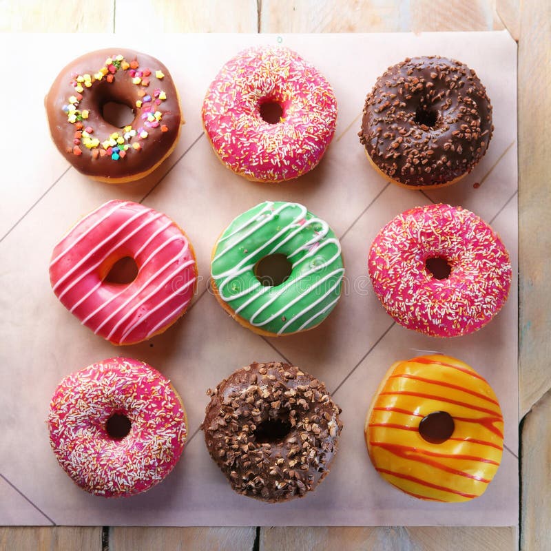 Colorful donuts. Assortiment of donuts with various colors and toppings. vector illustration