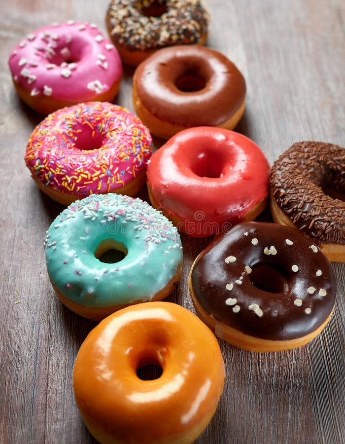 Colorful donuts. Assortiment of donuts with various colors and toppings. royalty free illustration