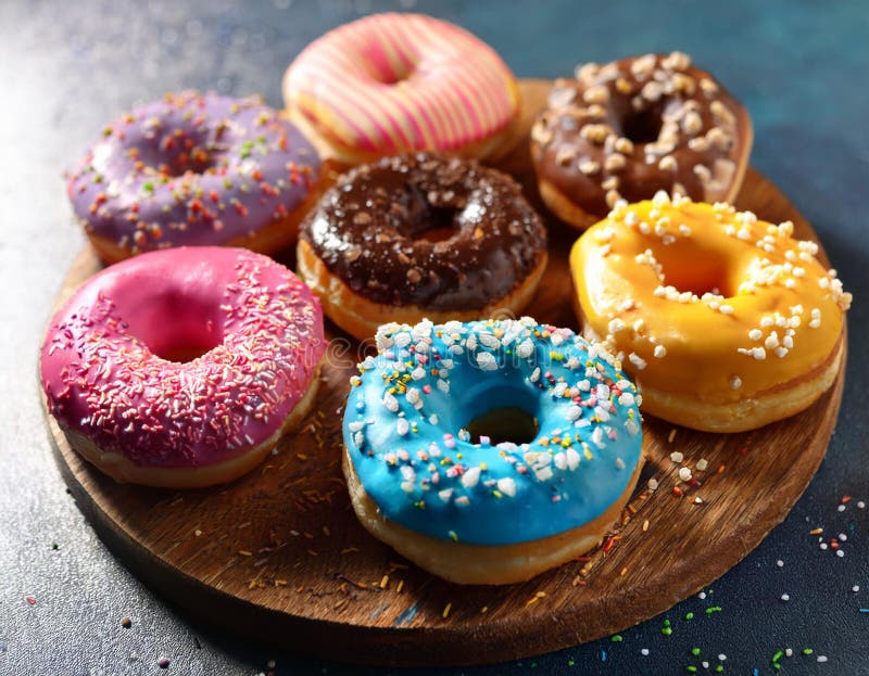 Colorful donuts. Assortiment of donuts with various colors and toppings. vector illustration