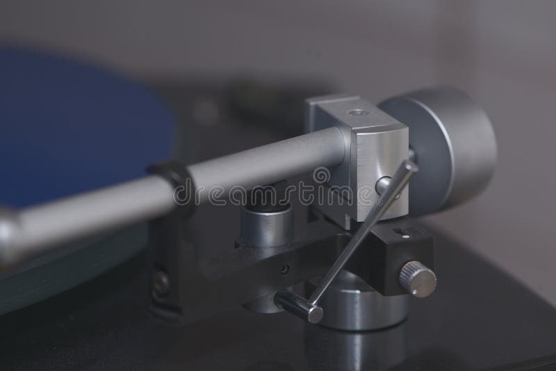 A close-up view of a turntable\'s tonearm assembly, showcasing its precision engineering stock photos