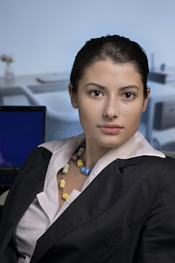 Focused Businesswoman in Modern Workspace royalty free stock photography