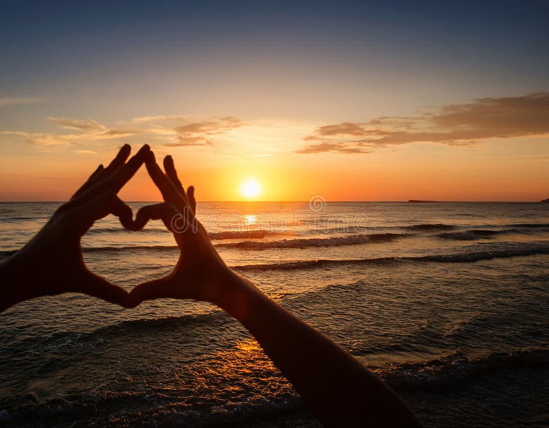 Sunset in heart hands - on sea royalty free illustration