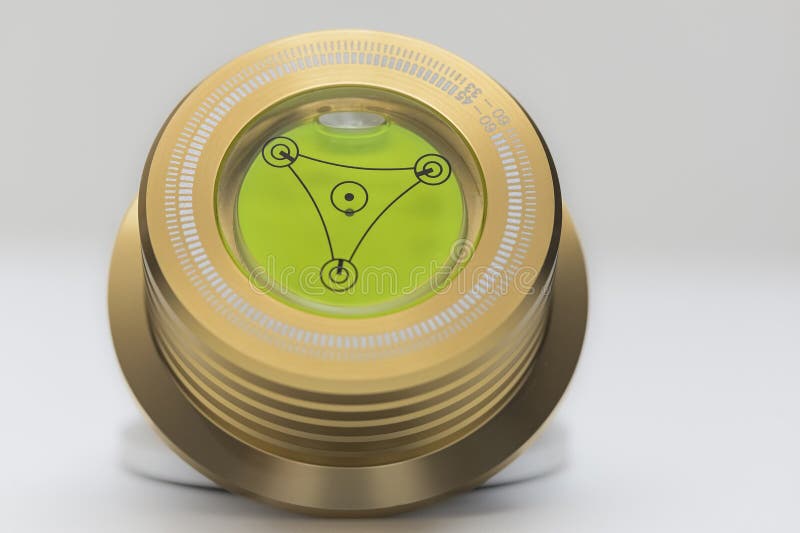 Precision Bullseye Spirit Level with Gold Anodized Aluminum Housing for Tripod or Turntable Alignment, Macro Close-Up stock image