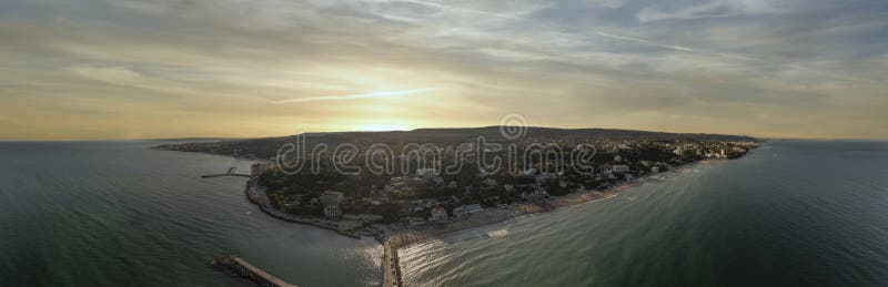 Panoramic aerial view of Black Sea coastline with beaches, resorts and sunset sky at Golden Sands Bulgaria