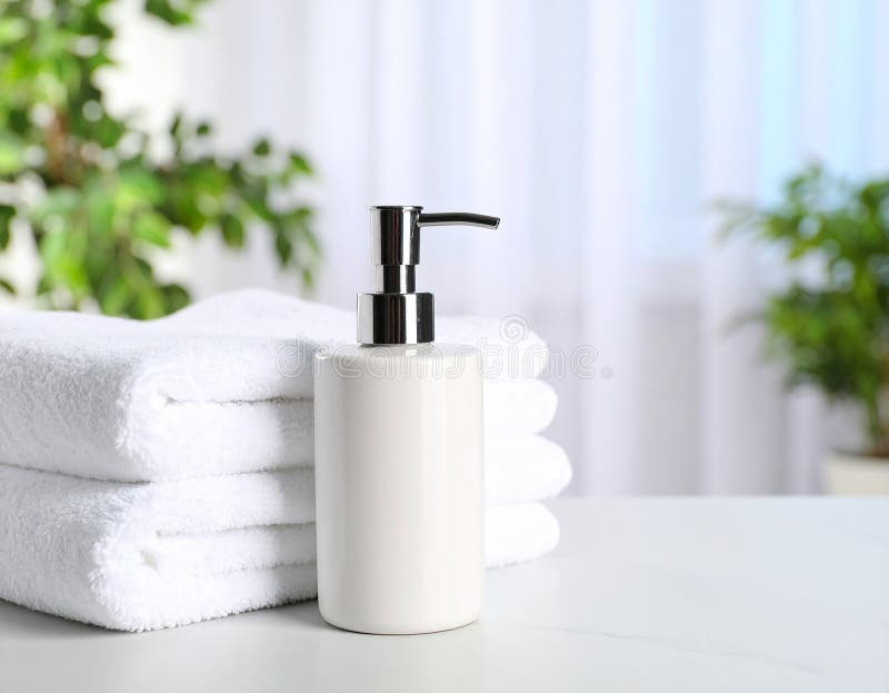 Soap dispenser and towels on table. Space for text stock illustration